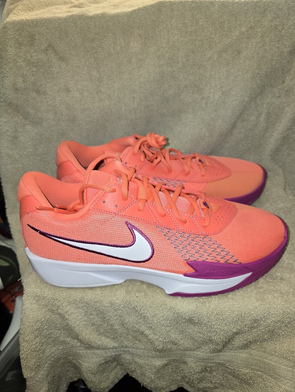 Nike G.T. Cut Academy basketball shoes in the Light Wild Mango/Hot Fuchsia color